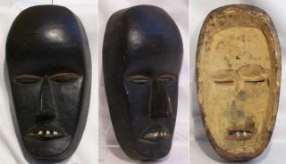 Four old carved wooden African masks Baule and Dan 2