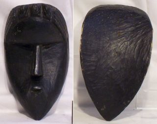 Four old carved wooden African masks Baule and Dan 7