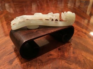 An Chinese Qing Dynasty Carved White Jade Belt Hook,  19th C.