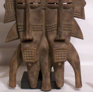20th Century Senufo carved wooden Kpelie Double faced mask on stand 3