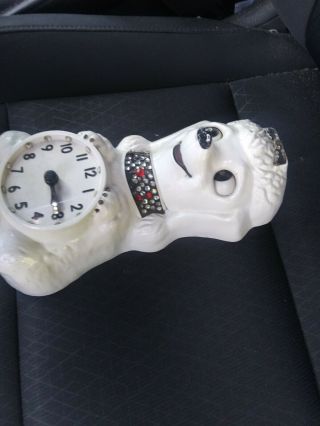 vintage french poodle clock it but it dont have its tail and 1 of its. 2