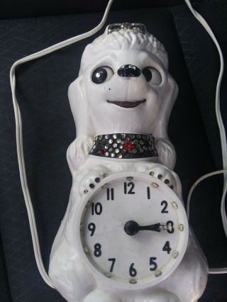 vintage french poodle clock it but it dont have its tail and 1 of its. 6
