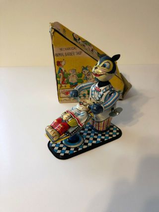 Mechanical Animal Barber Shop vintage tin wind up toy.  BRIGHT TIN & GREAT 3