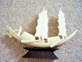 Chinese Hand Carved Bovine Bone Sailing Boat On Wooden Stand