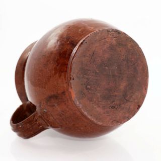 19th c.  large redware handled pitcher,  slip glazed with kiln spotting [11813] 6