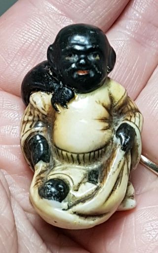 A Wonderful Edo Period Porcelain Netsuke Of Hotei With A Karako.