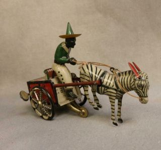 Rare Vintage Lehmann Daredevil Tin Wind Up Toy Man On Cart With Zebra