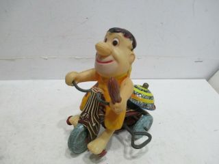 Fred Flinstone On Tricycle Wind Up - -