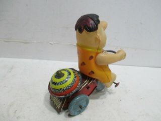 FRED FLINSTONE ON TRICYCLE WIND UP - - 3