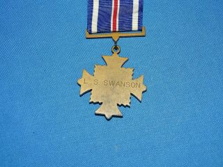 WWII - Vietnam Flying Cross Medal,  Named to: L.  S.  Swanson (C35) 3