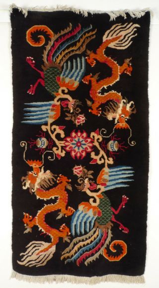 A Tibetan Dragon And Phoenix Rug With A Black Ground.  1.  Half Of 20th Century