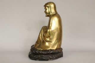 A Chinese bronze gilt figure of Bodhidharma Daruma Arhat,  wood stand 19th/20thc 4