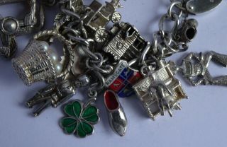 vintage solid silver charm bracelet & 29 charms.  Rare,  open,  move.  102.  8g 12