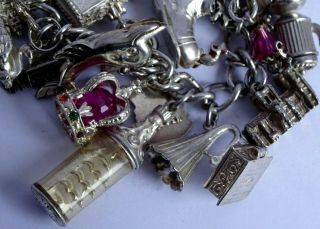 vintage solid silver charm bracelet & 29 charms.  Rare,  open,  move.  102.  8g 4