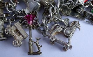 vintage solid silver charm bracelet & 29 charms.  Rare,  open,  move.  102.  8g 5