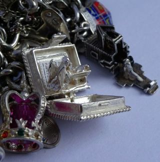 vintage solid silver charm bracelet & 29 charms.  Rare,  open,  move.  102.  8g 6