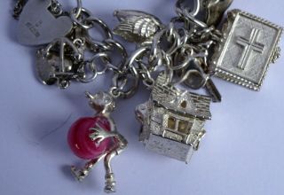 vintage solid silver charm bracelet & 29 charms.  Rare,  open,  move.  102.  8g 7