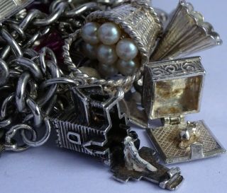 vintage solid silver charm bracelet & 29 charms.  Rare,  open,  move.  102.  8g 9