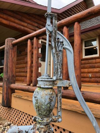 antique water pump with water can 2