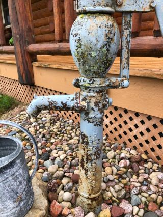 antique water pump with water can 5