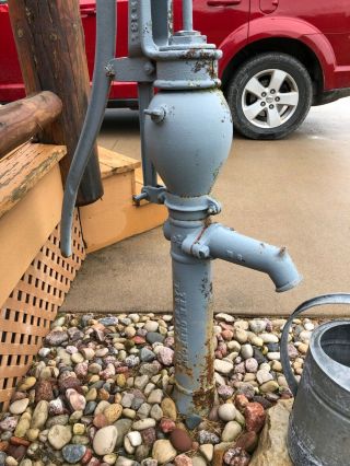 antique water pump with water can 6