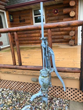 antique water pump with water can 8