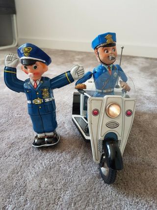 2x Nomura Tin Toy,  Patrol Auto - Tricycle & Traffic Policeman 1950s Japan - -