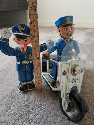 2x NOMURA TIN TOY,  Patrol Auto - Tricycle & TRAFFIC policeman 1950s Japan - - 2