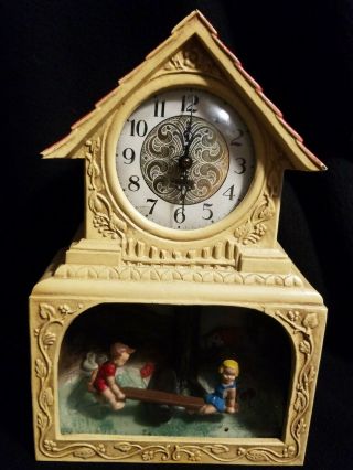 Haddon Electric Novelty Clock " The Teeter Totter " Lighted Motion