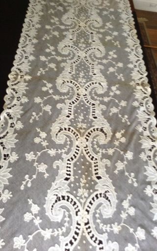 antique tambour lace curtains,  2 panels @ 75 by 25.  5 