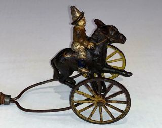 18 - 1900’s Mechanical Cast Iron Clown On Donkey Wood Handle Push Toy