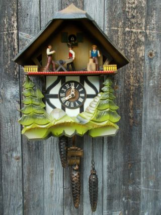 Vintage German Chalet Musical Cuckoo Clock With Wood Choppers Animated