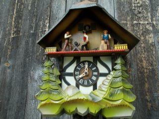 VINTAGE GERMAN CHALET MUSICAL CUCKOO CLOCK WITH WOOD CHOPPERS ANIMATED 2