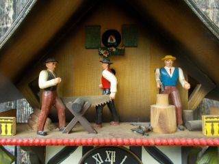 VINTAGE GERMAN CHALET MUSICAL CUCKOO CLOCK WITH WOOD CHOPPERS ANIMATED 3