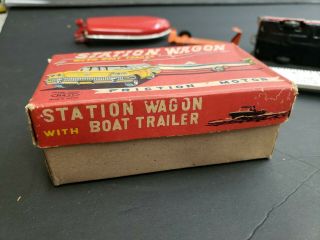 Vintage tin toy station wagon with boat friction Japan 10