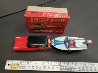 Vintage tin toy station wagon with boat friction Japan 2