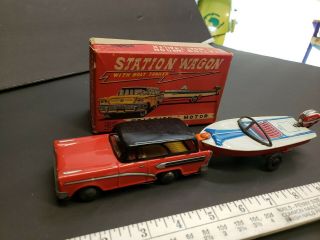 Vintage tin toy station wagon with boat friction Japan 3