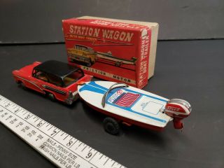 Vintage tin toy station wagon with boat friction Japan 4
