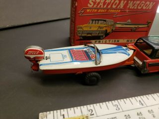 Vintage tin toy station wagon with boat friction Japan 6