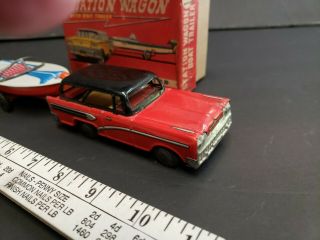 Vintage tin toy station wagon with boat friction Japan 7
