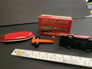 Vintage tin toy station wagon with boat friction Japan 8
