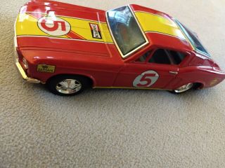 Tin Ford Mustang,  by Bandai,  in near. 3