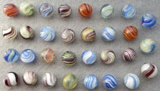 31 Vintage Marbles,  Various Sizes Ranging From Just Over 14 To Just Over 15 Mm.