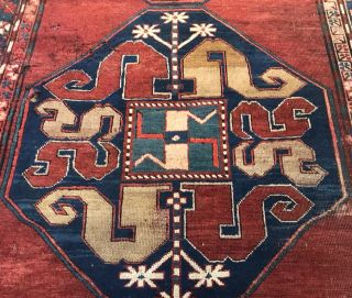 AN ANTIQUE CAUCASIAN KAZAK RUG 4