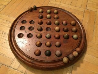 Mid 19th Century Round Wood Solitare Game With Wood Marbles & Checkers For Feet
