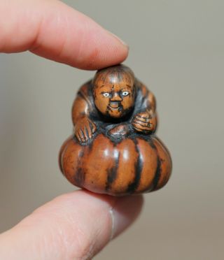Antique Japanese Netsuke Of A Child Playing With A Giant Pumpkin,  19th Century.