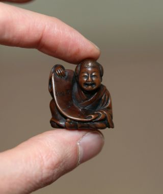 Antique Japanese Netsuke Of A Child Playing With Scroll,  Signed Sani,  19th Cent.