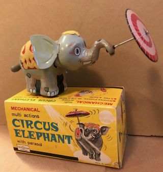 C.  1950 Ck Japan Tin Wind - Up Circus Elephant Toy With Parasol