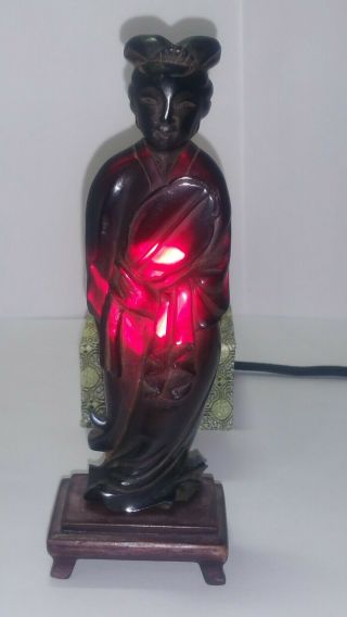 Chinese Cherry Amber Bakelite Faturan Concubine Lady With Fan Carving On Stand.