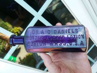 PURPLE DR A.  C.  DANIEL ' S WONDER WORKER LOTION BOSTON,  MASS.  U.  S.  A.  PATENT MEDICIN 8